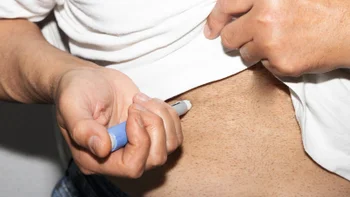 ozempic: closeup man stomach injection 1629524107