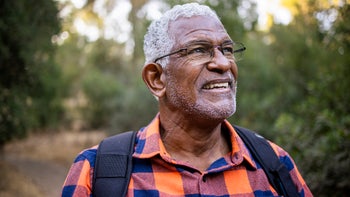 Health: healthy-mind: portrait senior man hiking-1283561316