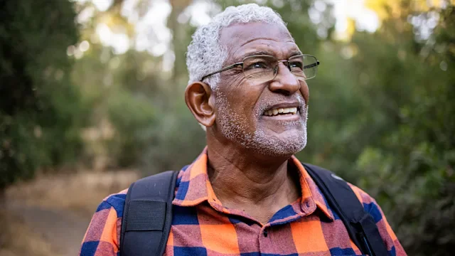 Health: healthy-mind: portrait senior man hiking-1283561316