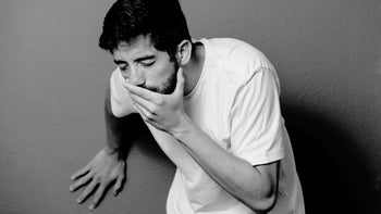 Health: Nausea: man visably sick hand on mouth 892432362