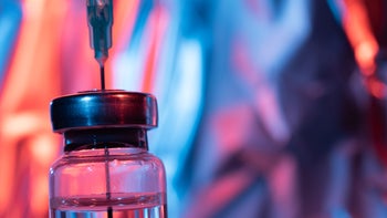Malaria: Vaccine: close-up vaccine vial needle 1225223112