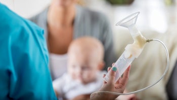 Parenthood pregnancy: Lactation consultant: lactation pump in hands-859125694