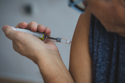 Close-up of a woman using an insulin pen injector on her arm.
vitapix/E+ via Getty Images