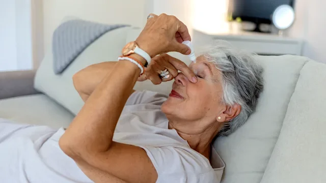 Prolensa: woman using eye drops at home 1337792001