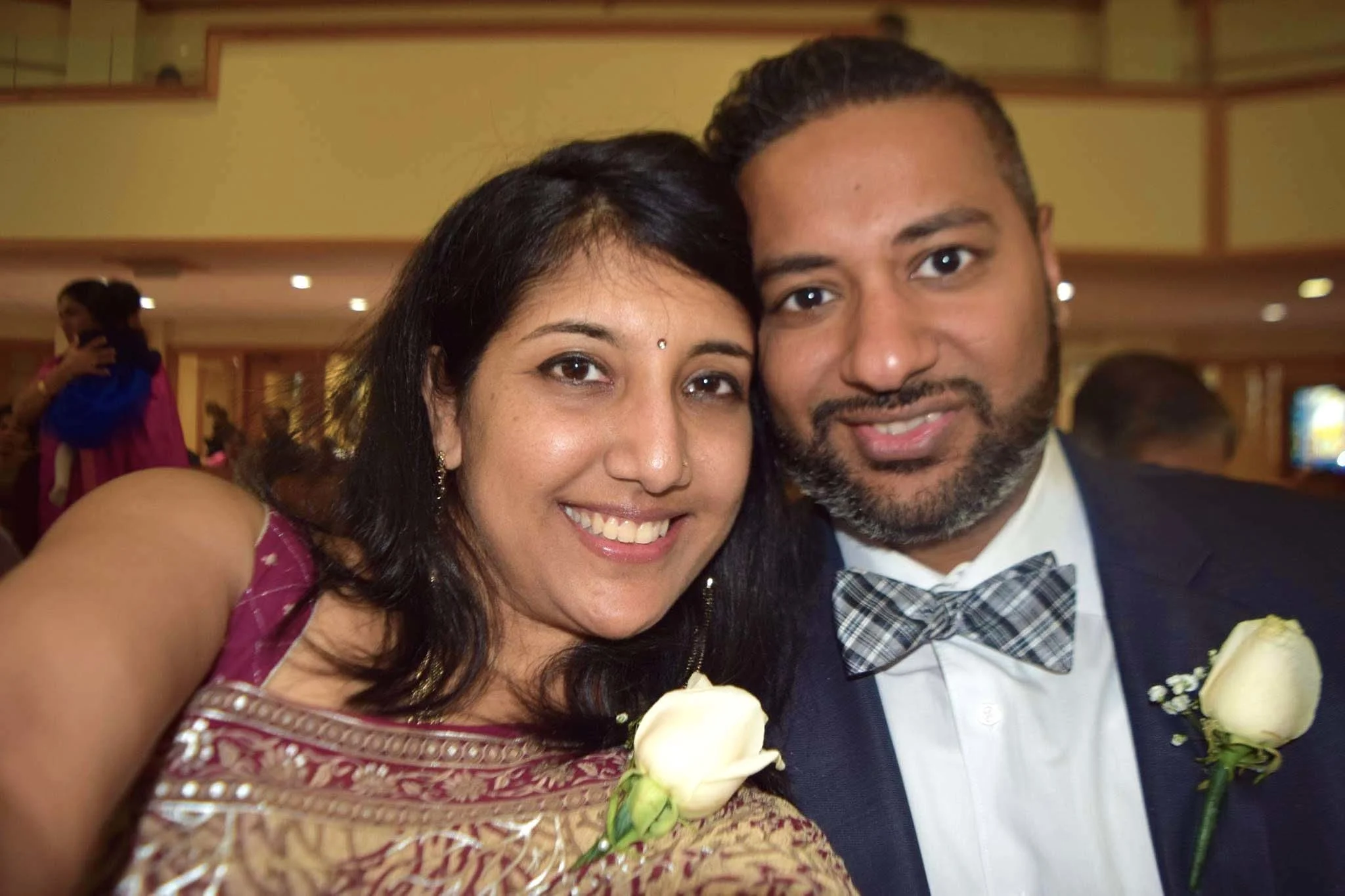 Photo of a couple smiling.