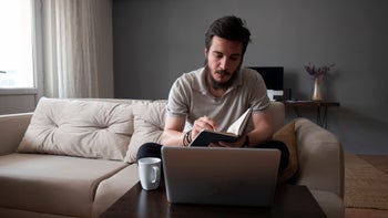 man journaling at home-1277206031