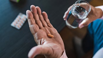 Valsartan: closeup pill in hand 1432973935