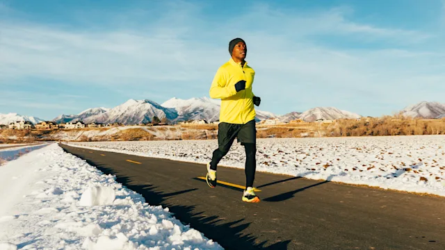 Movement exercise: man running in winter 1201858420