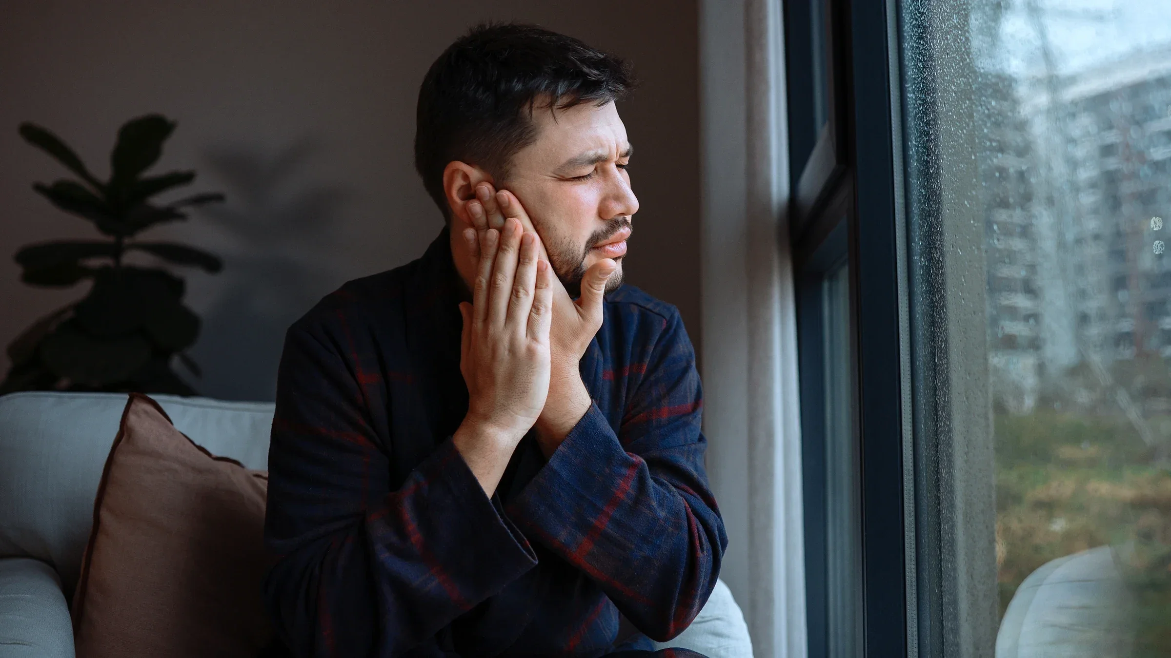 Man with ear pain
ozgurcankaya/iStock via Getty Images Plus