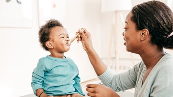 Health: Childrens health: mother feeding toddler yogurt with spoon-636585746