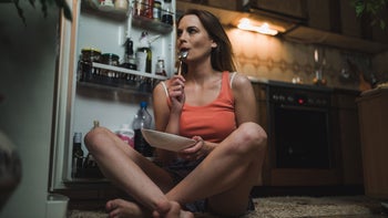 Health: Cannabis: woman eating midnight snack GettyImages 1127910459