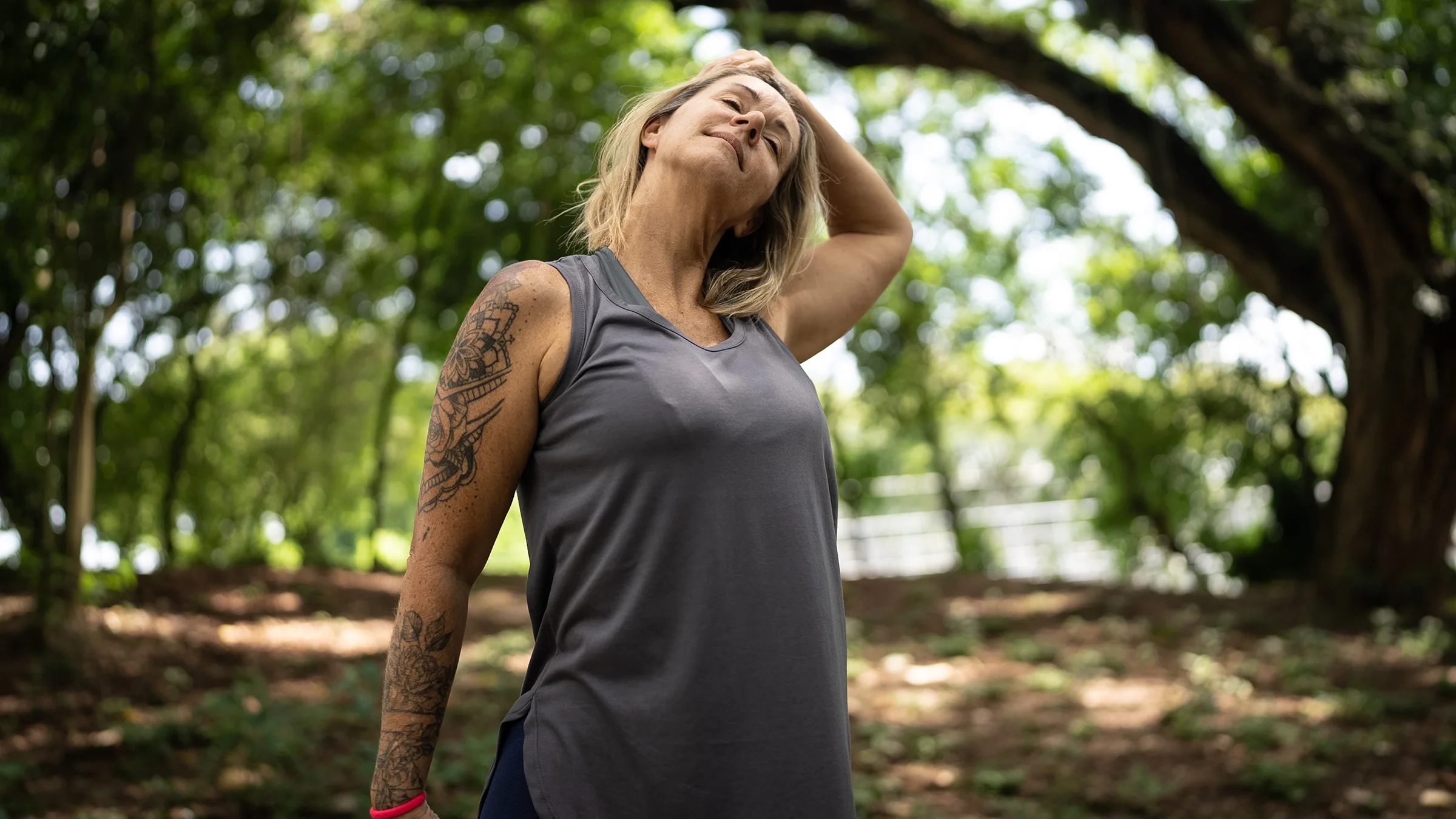 Woman stretching in a park.
