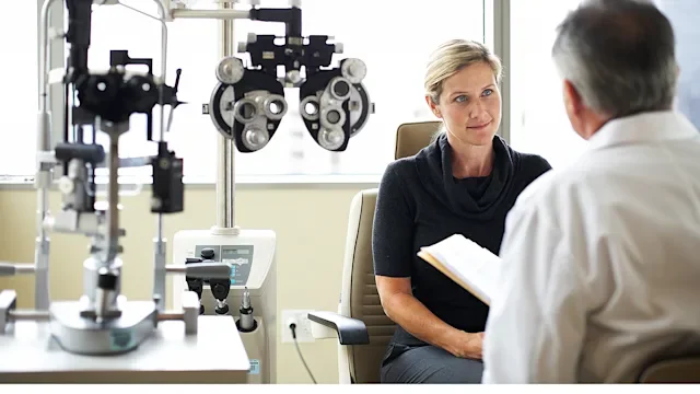 Health: Eye: woman at eye exam with doctor-89987853