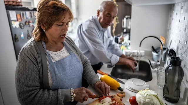 Coronary-artery-disease: senior couple preparing meal 1475584077