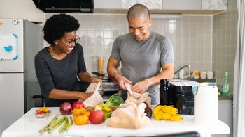 Health: High cholesterol: couple sorting vegetables 1385218220