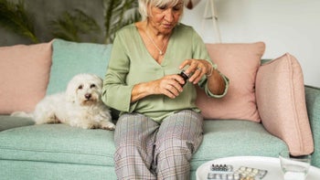 Senior Health: senior woman opening medicine 1426176747