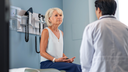 Woman speaking to doctor at medical appointment.
FatCamera/E+ via Getty Images