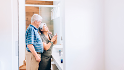 Senior Couple preps for a night out.
Credit: cokada/E+ via Getty Images