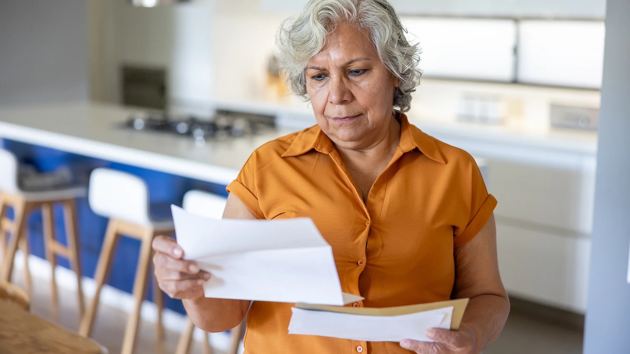 Woman reading medication paperwork