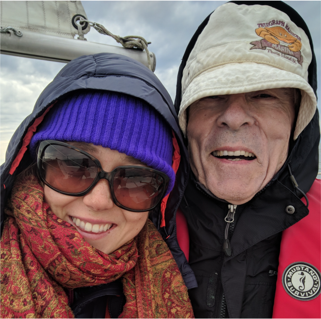 Author Clare Hennig, left, and her grandfather, dressed for cold weather, crossing the Strait of Georgia during a sailing trip.
