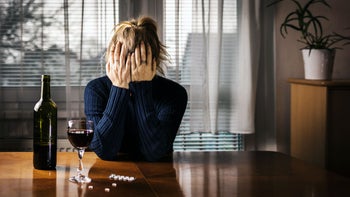 Health: Substance use: woman wine pills 1201530621