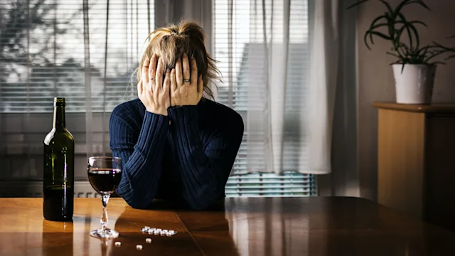Health: Substance use: woman wine pills 1201530621