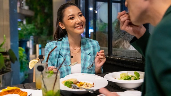 A couple enjoying dinner in a restaurant.