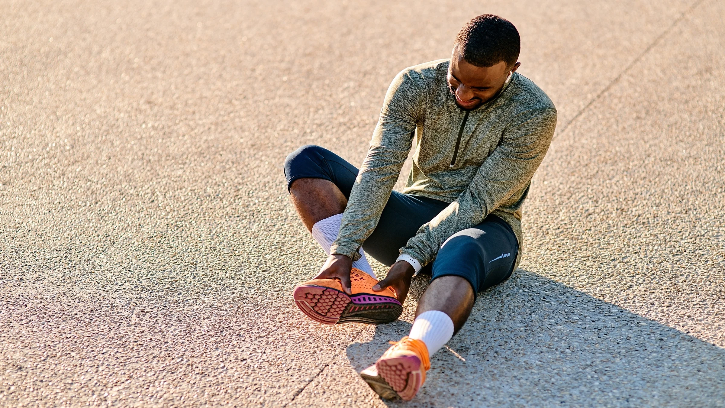 A man experiences foot pain.