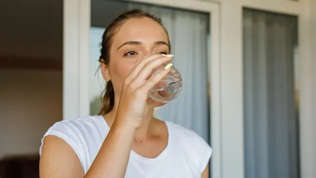 Diet Nutrition: woman drinking glass of water 1420937950