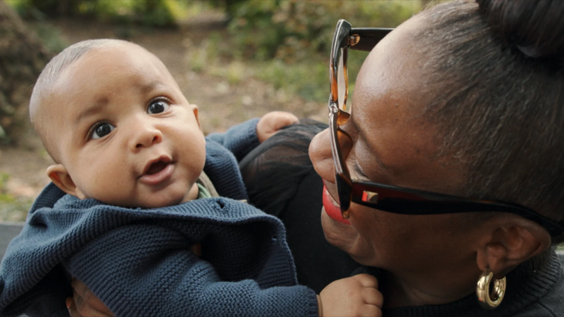 Kimberly Seals Allers is pictured holding a baby boy in a screenshot from her documentary.