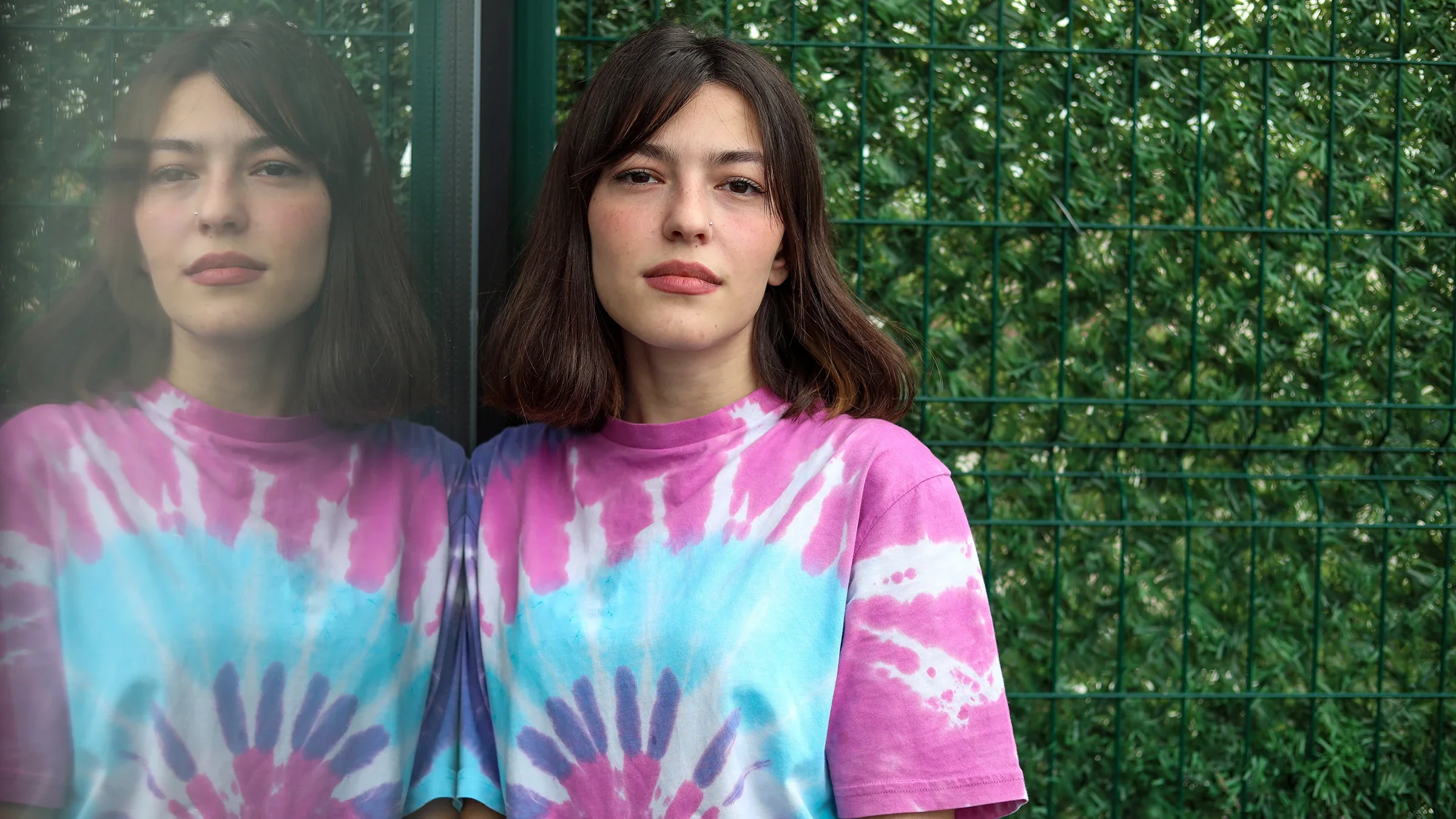 schizophrenia: young woman portrait tie dye shirt-1320987858