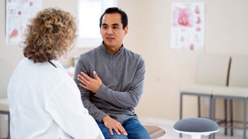 brilinta: man speaking to doctor 1147430181