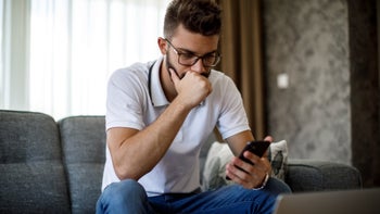 Substance use disorder: Rehab alternatives: thinking using phone on couch 1284992023