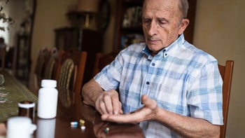 Hydroxyzine: Interactions: senior man sorting daily pills 1205275248