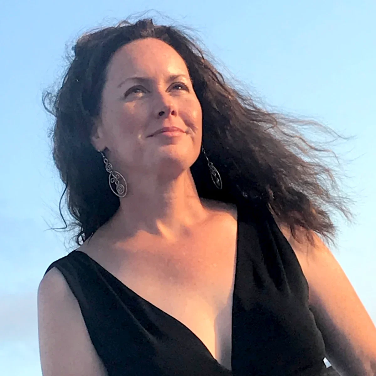Jessica Keenan Smith is pictured in a snapshot, outdoors, with her hair blowing in the breeze.