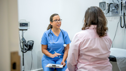 A woman attends a medical appointment.
FatCamera/E+ via Getty Images