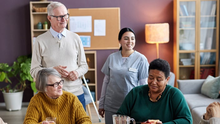 Nursing home residents having breakfast.
