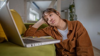 Women's Health: young woman focusing on laptop screen 1451411184