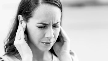 Health: Side effects: black and white woman with ear pain 1209268264