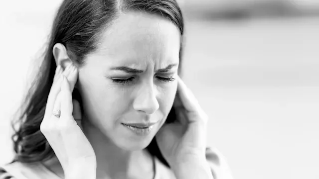 Health: Side effects: black and white woman with ear pain 1209268264