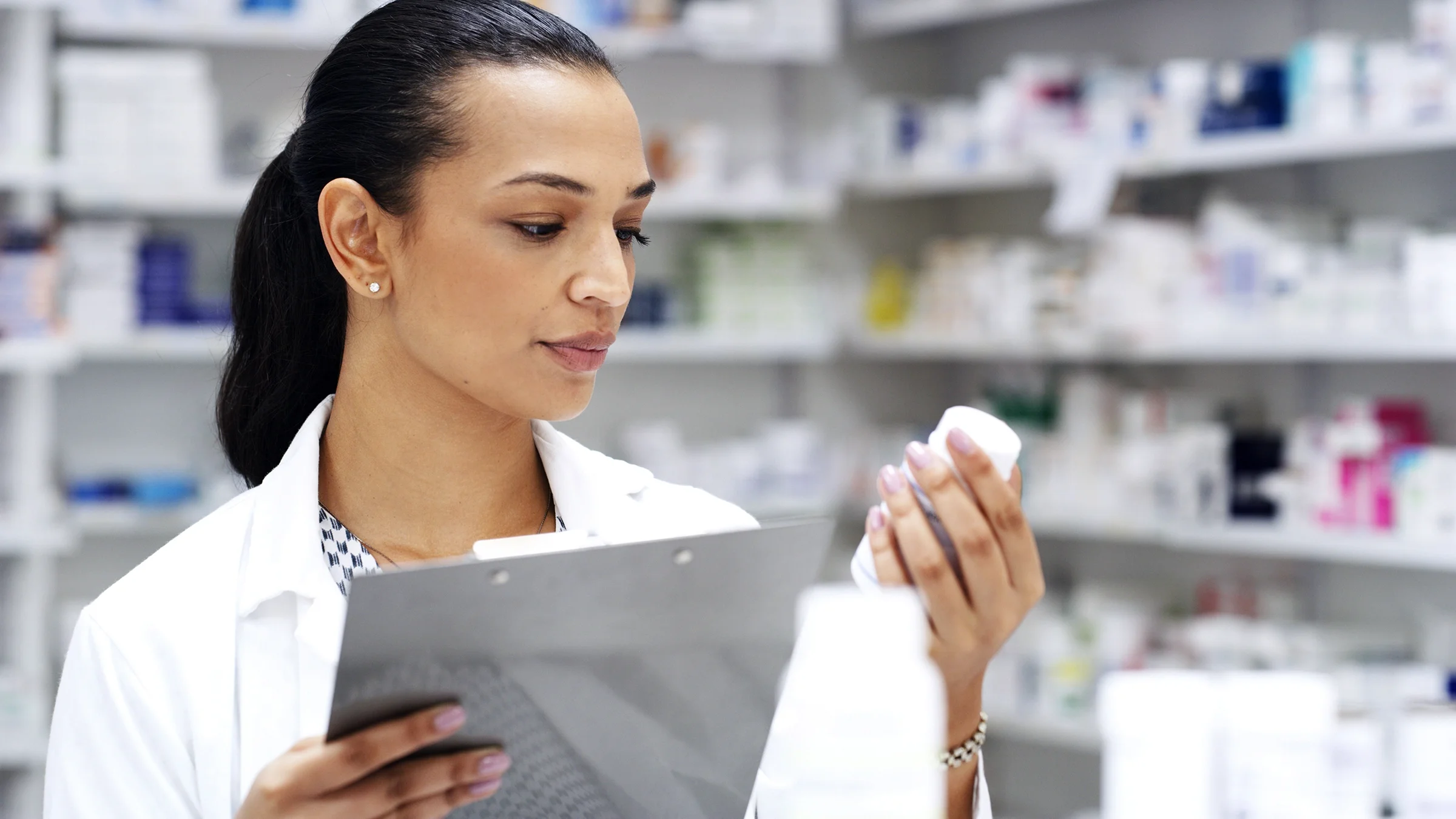 A healthcare professional lists medications for a patient.