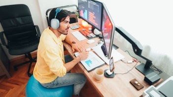 Movement-exercise: man sitting on yoga ball while WFH 1463408498