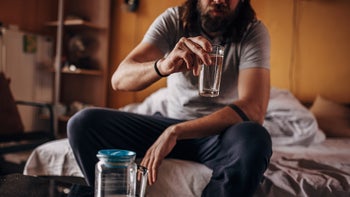Substance use: Unhigh: drinking water on sofa bed 1402961744