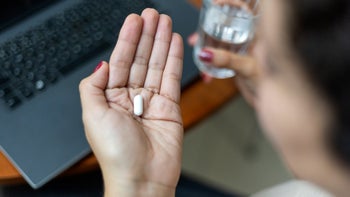 Acetaminophen: closeup pill in palm of hand 1428122069
