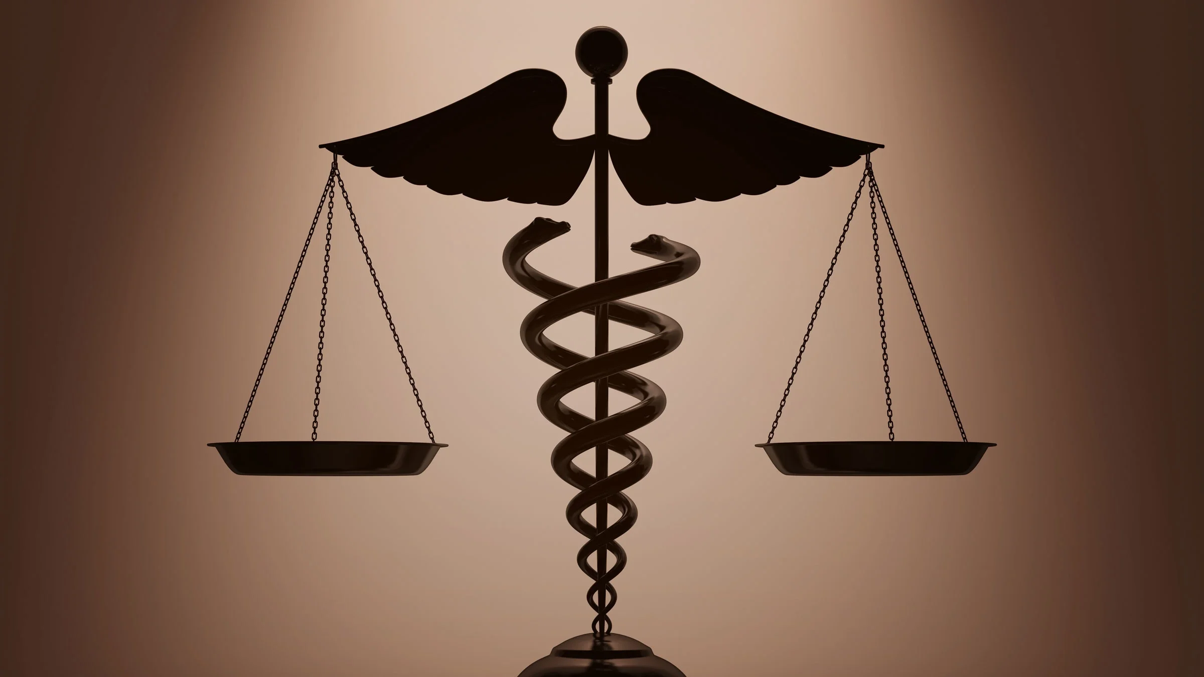 A 3D rendering depicts a caduceus and scales.
