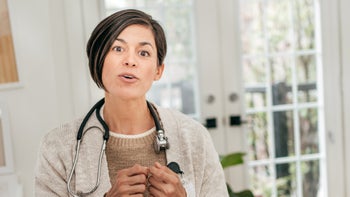 Abortion: doctor talking to camera 1279240870