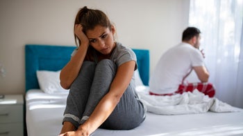 Health: Sexual health: woman upset in bed with man-1180173957