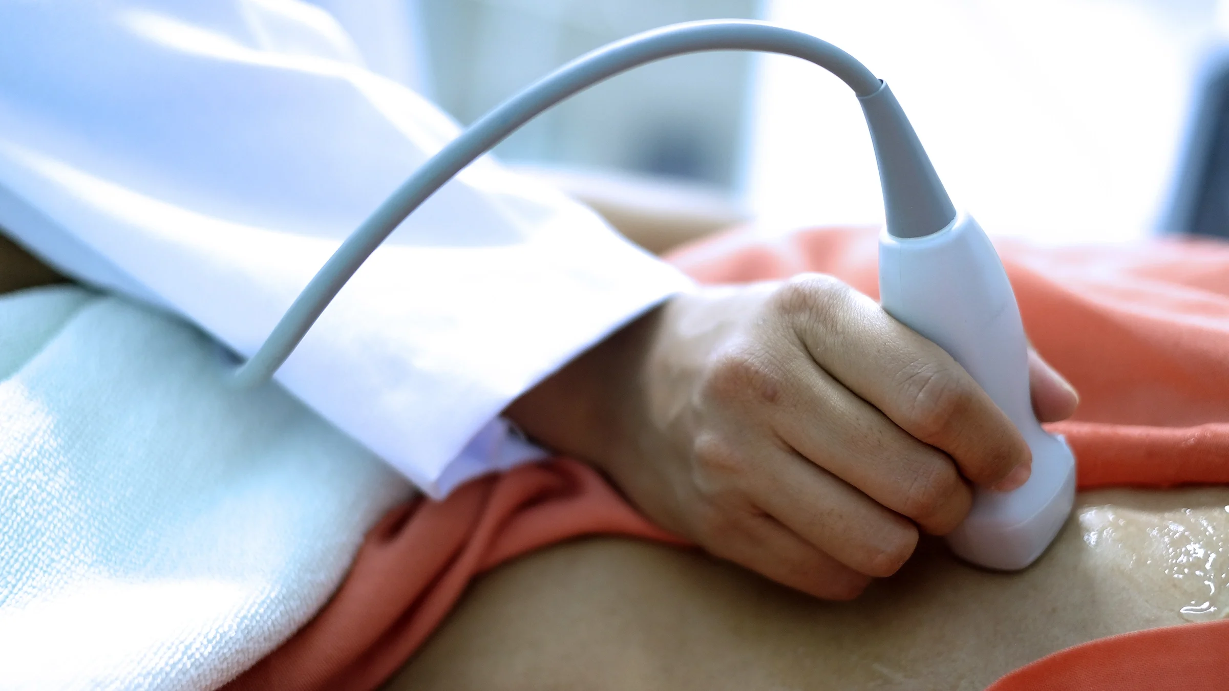 An echocardiogram of a male patient is seen close-up.