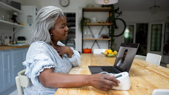 Telehealth: woman speaking to doctor online 1432413408