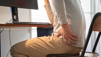 Health: Testopel: man backpain at desk 1275745869
